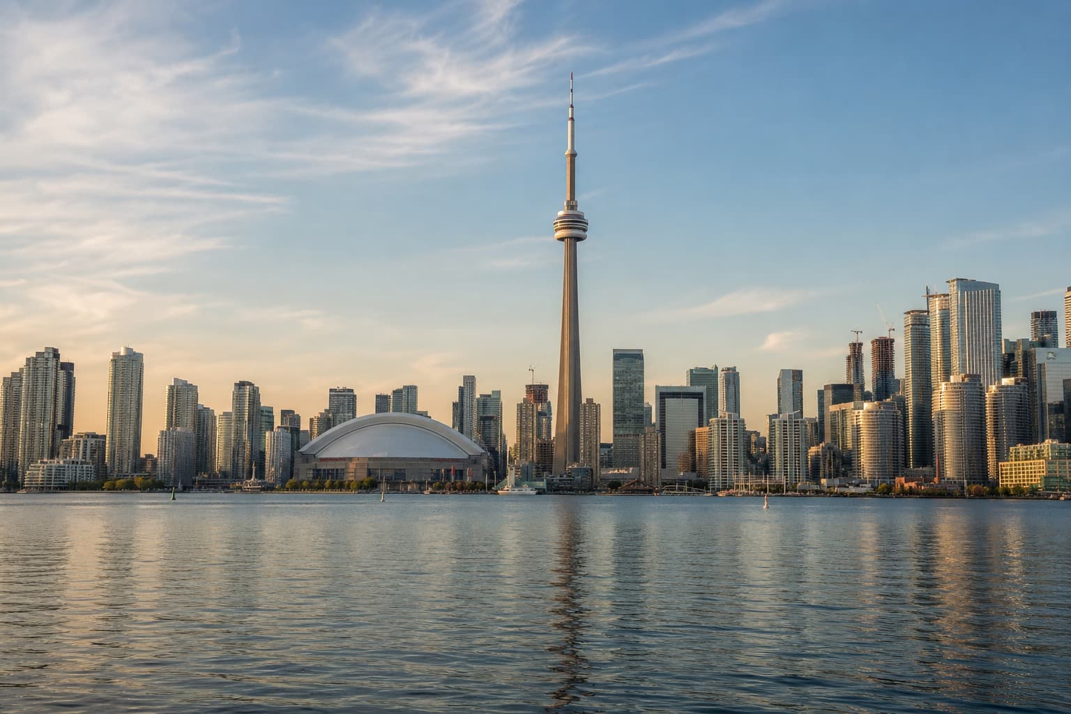 Toronto skyline with the CN Tower and waterfront at golden hour