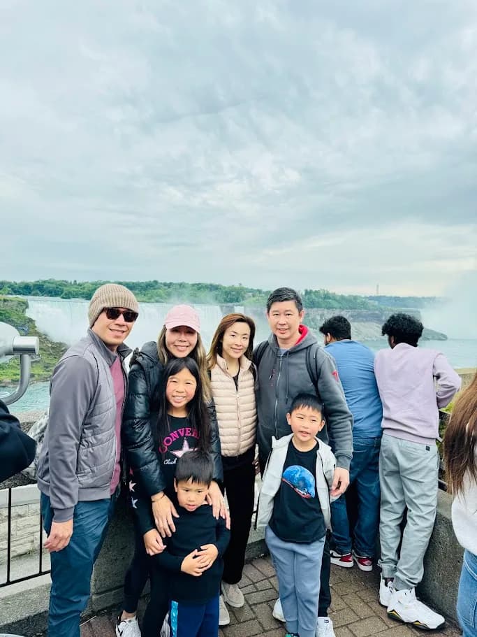 Family group posing at a Niagara Falls viewpoint