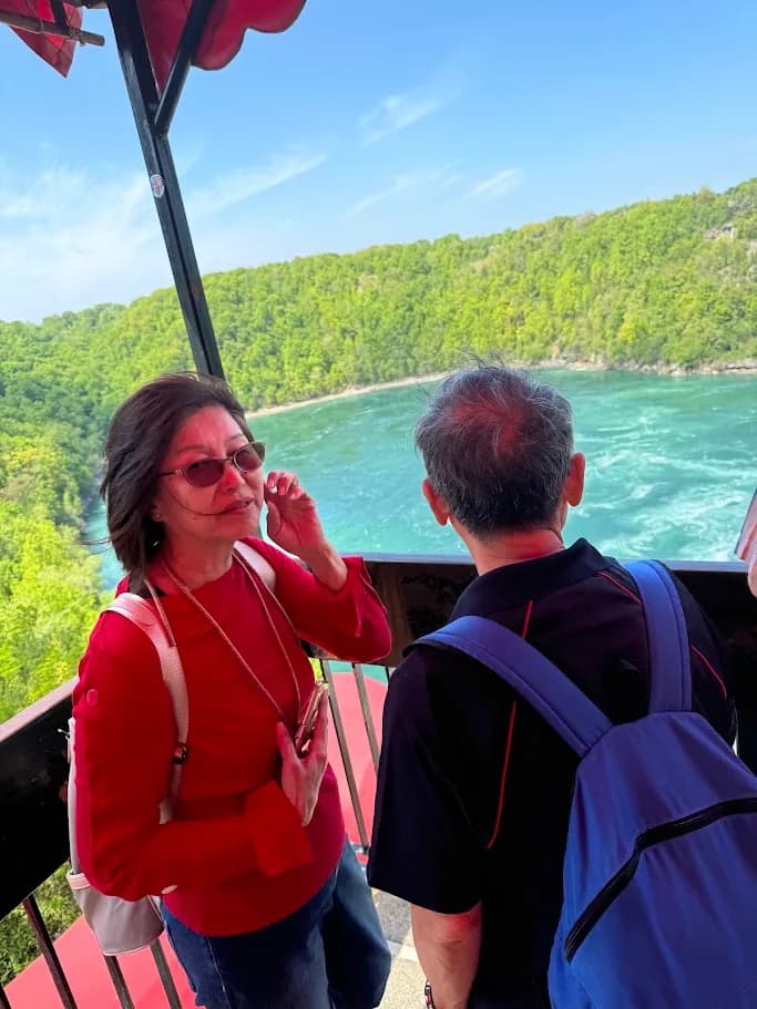 Guests looking across the Niagara Whirlpool from a scenic viewpoint