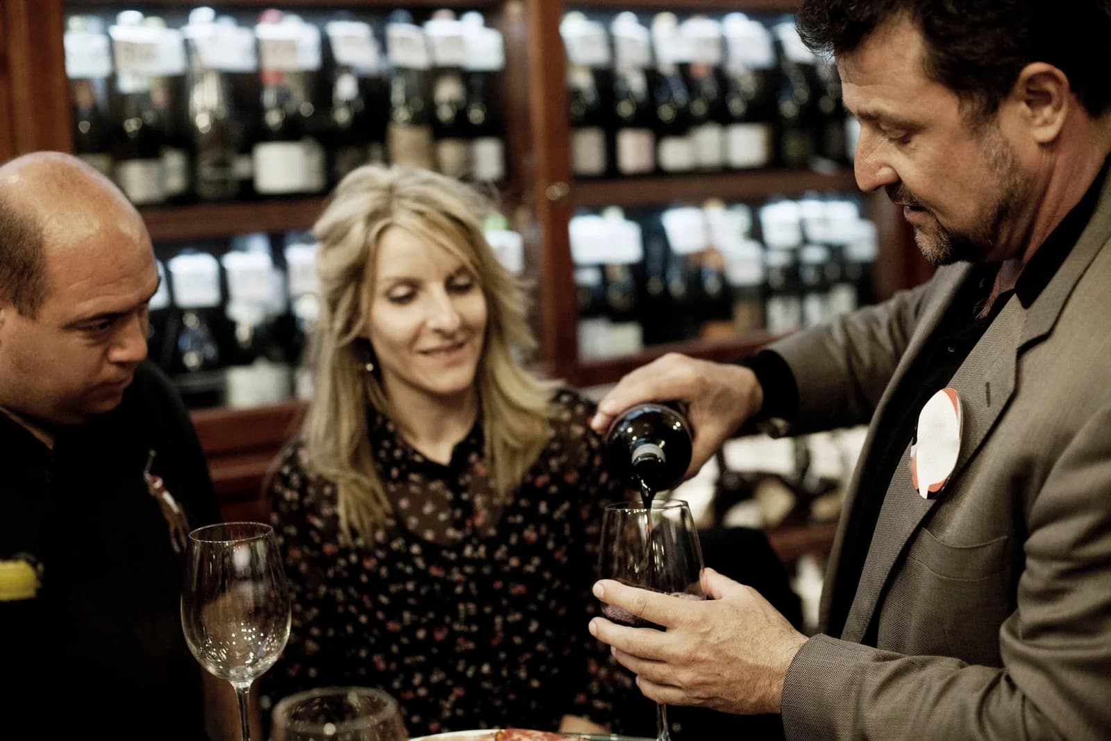 Wine being poured during a tasting experience