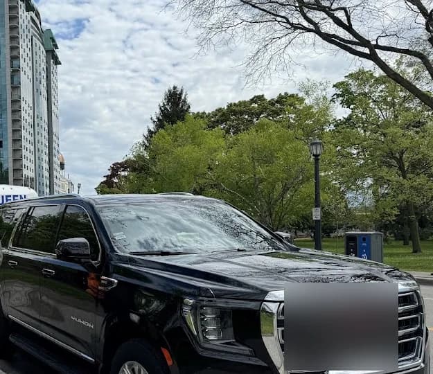 Luxury SUV parked near a Toronto-area hotel pickup zone